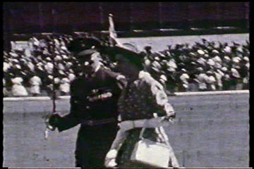 Flight Lieutenant A. Roberts escorts Princess Elizabeth to inspect the RAF Guard of Honour at Eastleigh Airport, Nairobi on 1st February 1952.