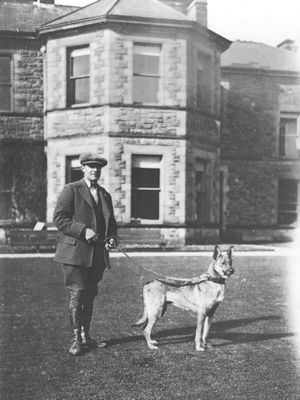 Tommy Thompson the Gamekeeper and Patou in front of Redburn House
